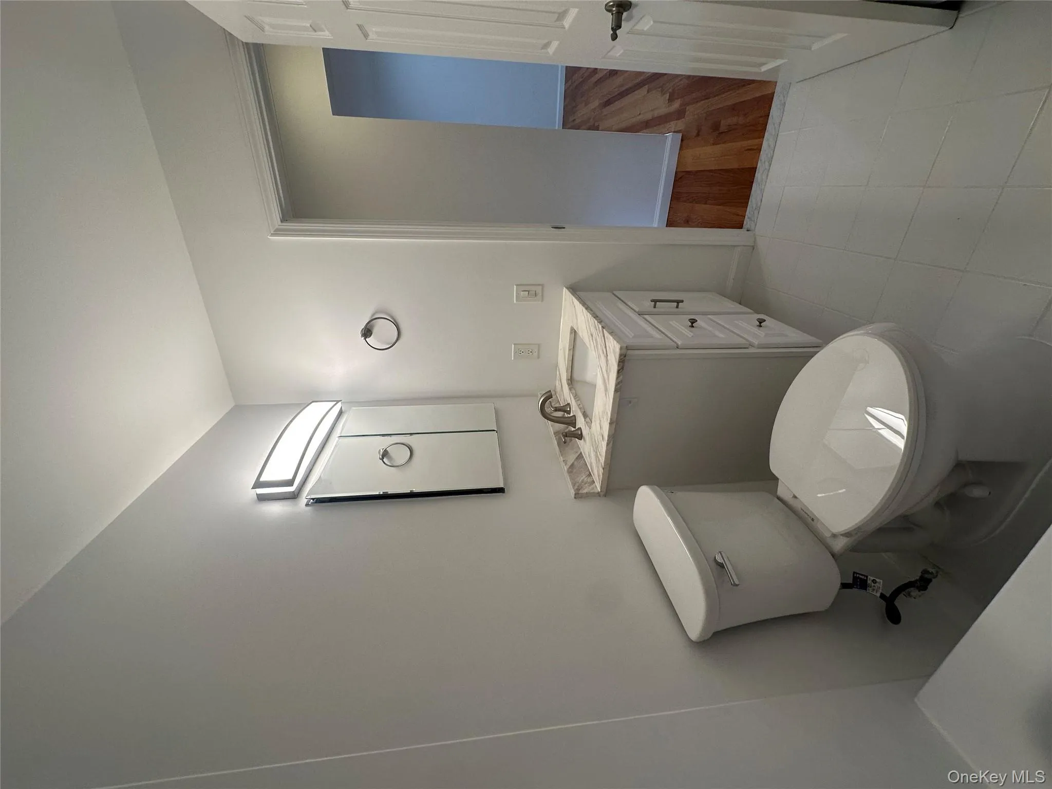 Bathroom featuring vanity and light tile patterned floors Bathroom featuring vanity and light tile patterned floors