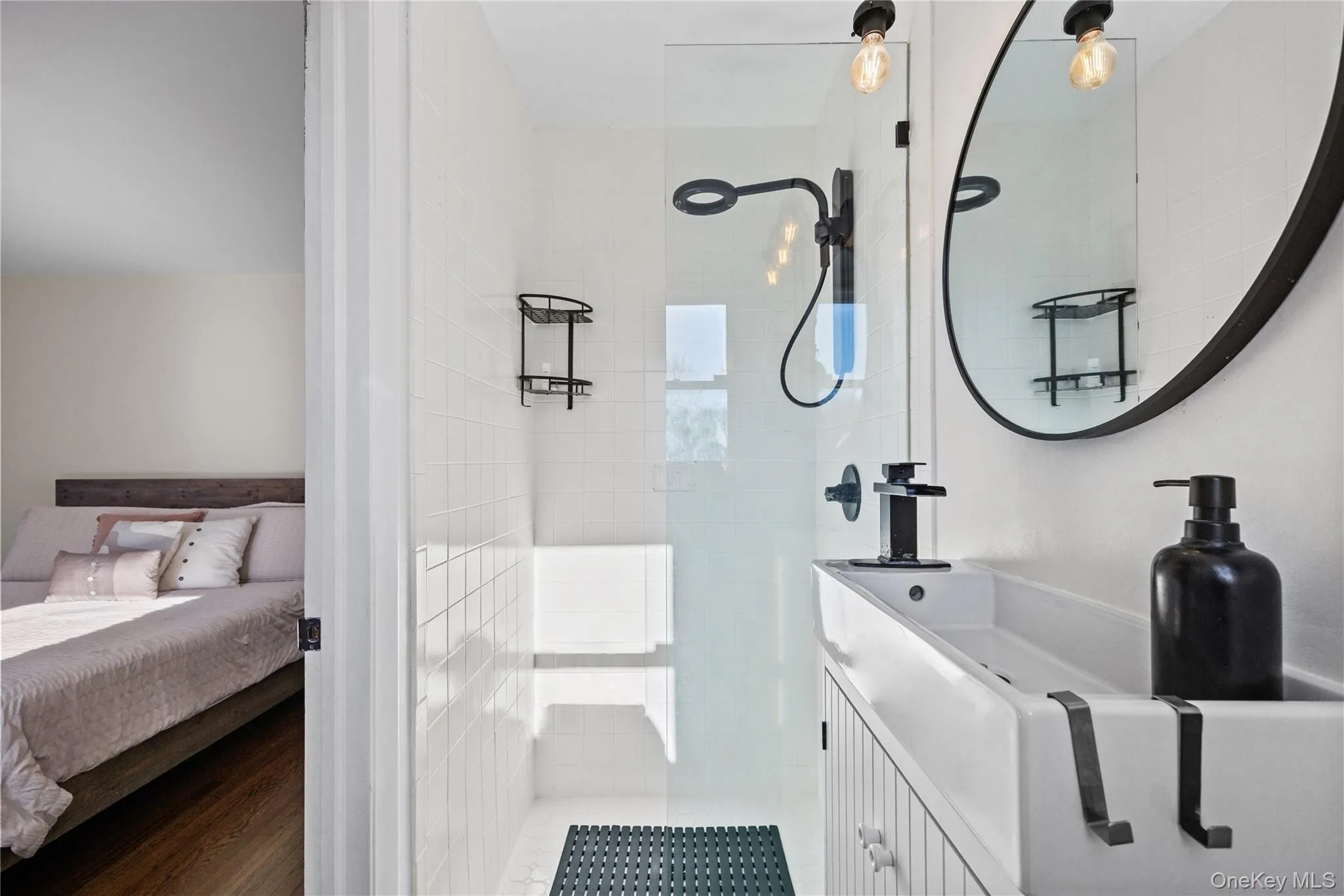 Ensuite bathroom with a walk in shower and wood finished floors Ensuite bathroom with a walk in shower and wood finished floors