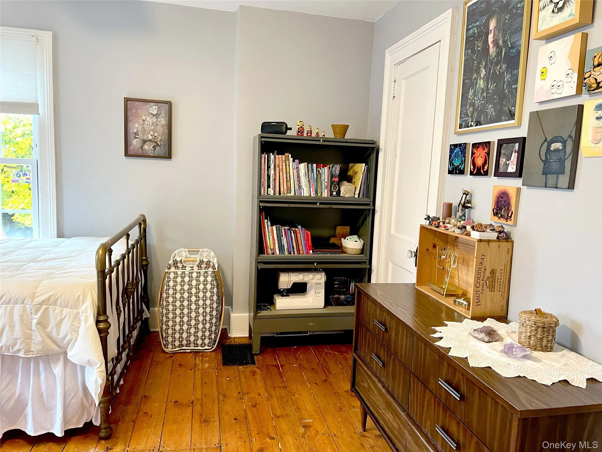 Bedroom with wood-type flooring and baseboards Bedroom with wood-type flooring and baseboards