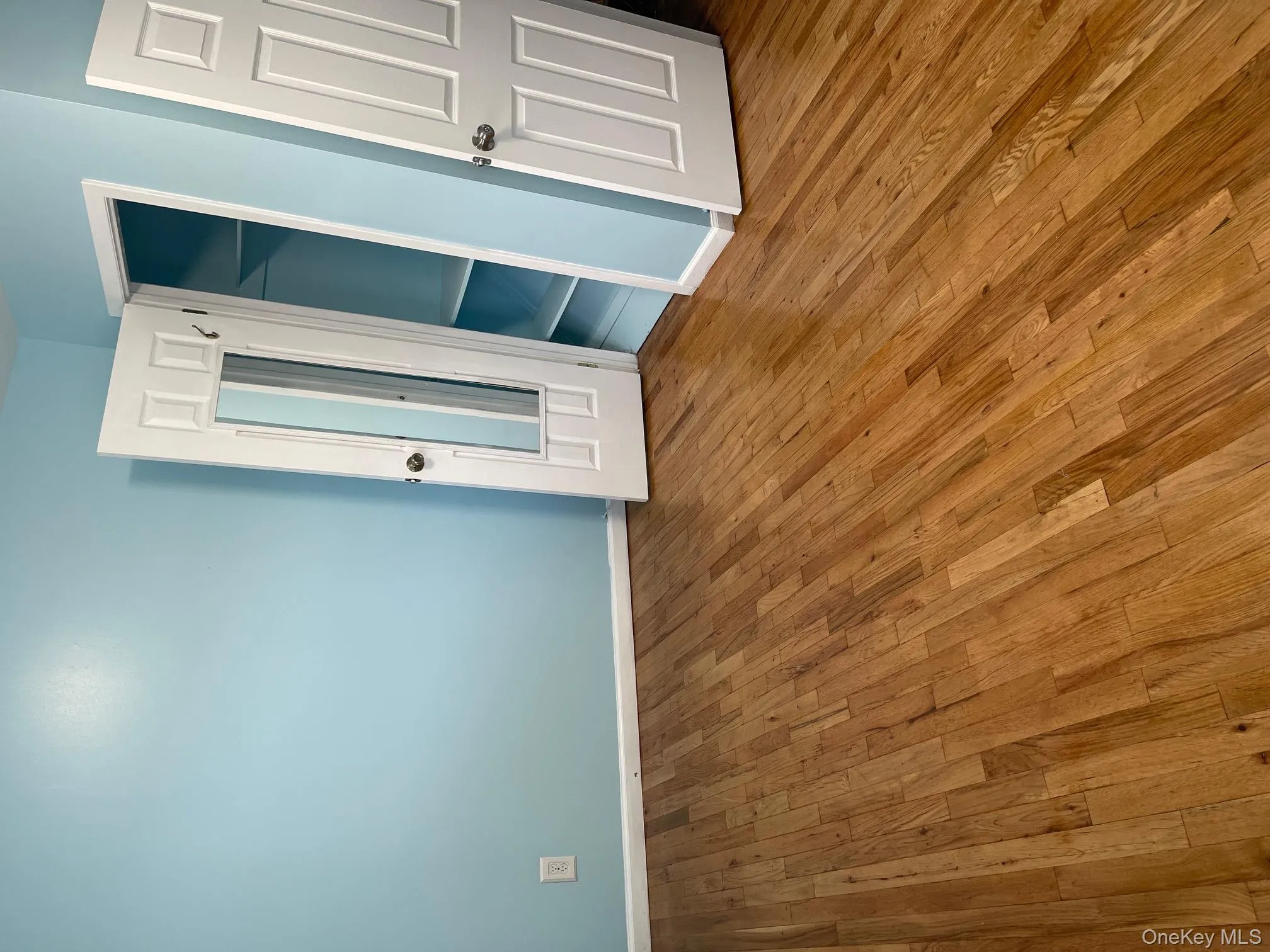 Unfurnished bedroom featuring hardwood / wood-style floors and a closet Unfurnished bedroom featuring hardwood / wood-style floors and a closet