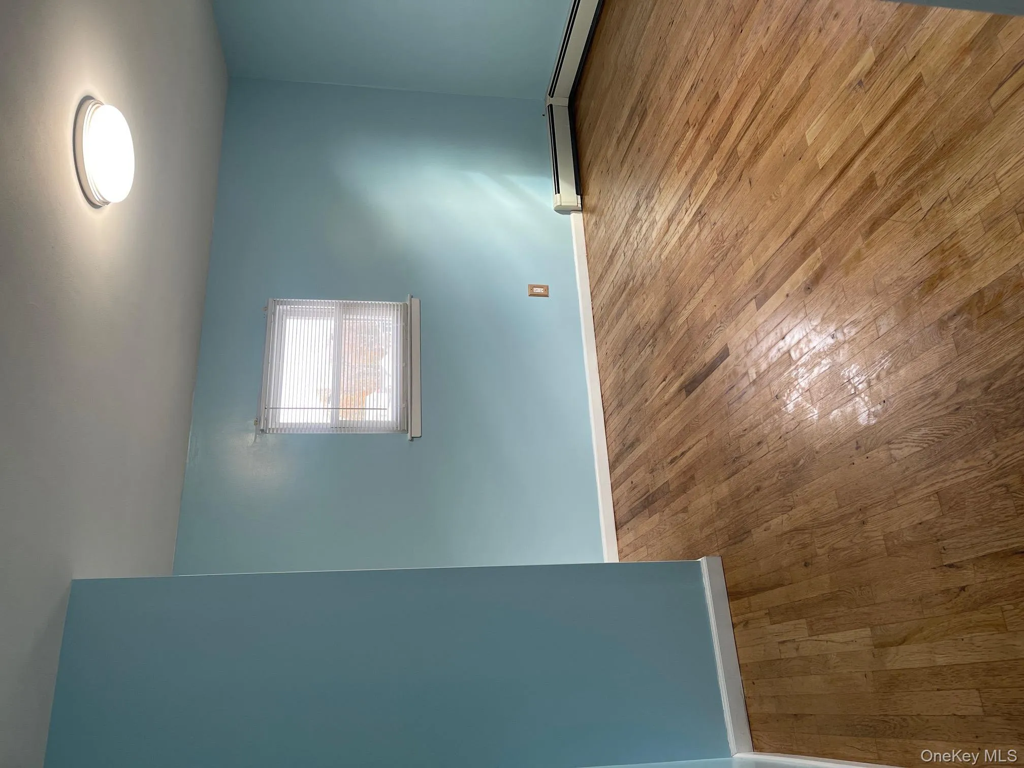Empty room featuring wood-type flooring Empty room featuring wood-type flooring