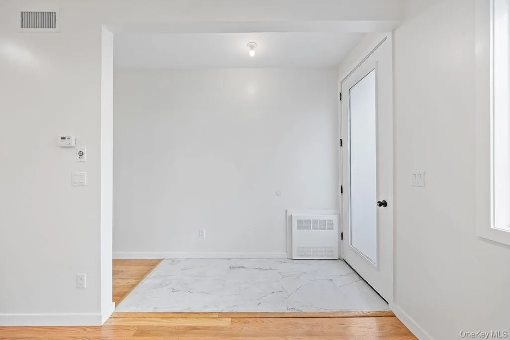 Unfurnished room featuring light wood-style floors Unfurnished room featuring light wood-style floors