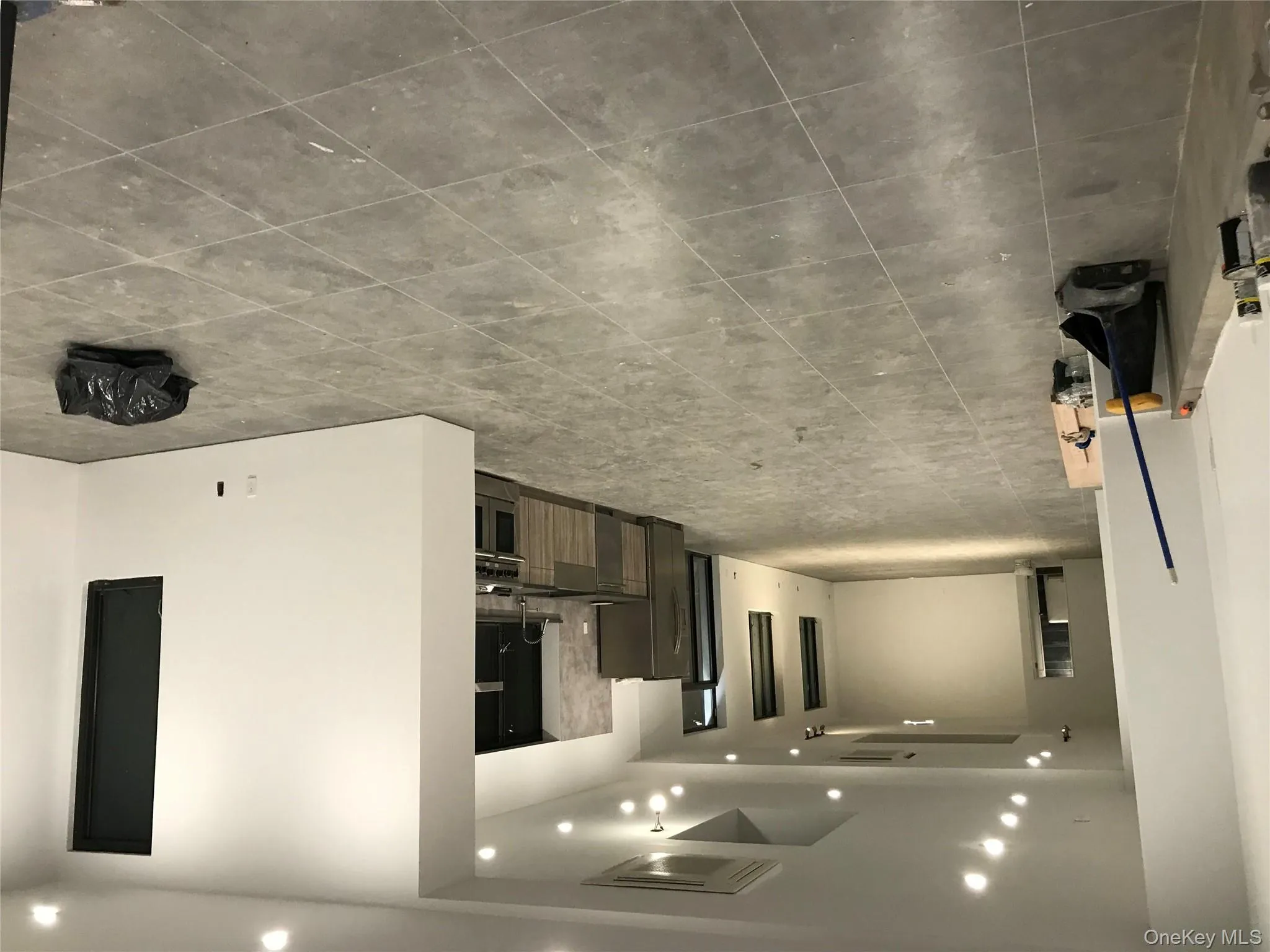 Unfurnished living room with recessed lighting and tile patterned floors Unfurnished living room with recessed lighting and tile patterned floors