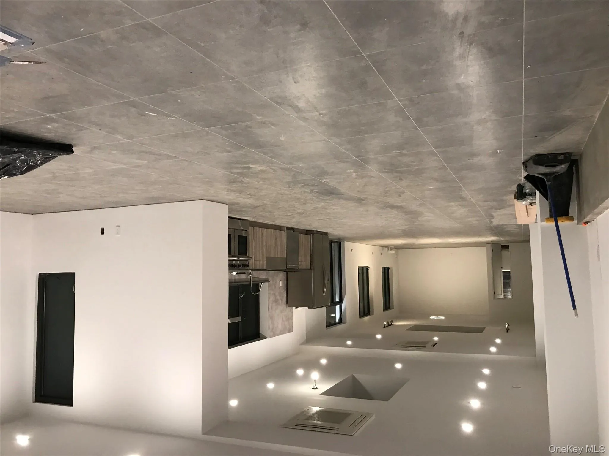 Unfurnished living room featuring tile patterned floors and recessed lighting Unfurnished living room featuring tile patterned floors and recessed lighting