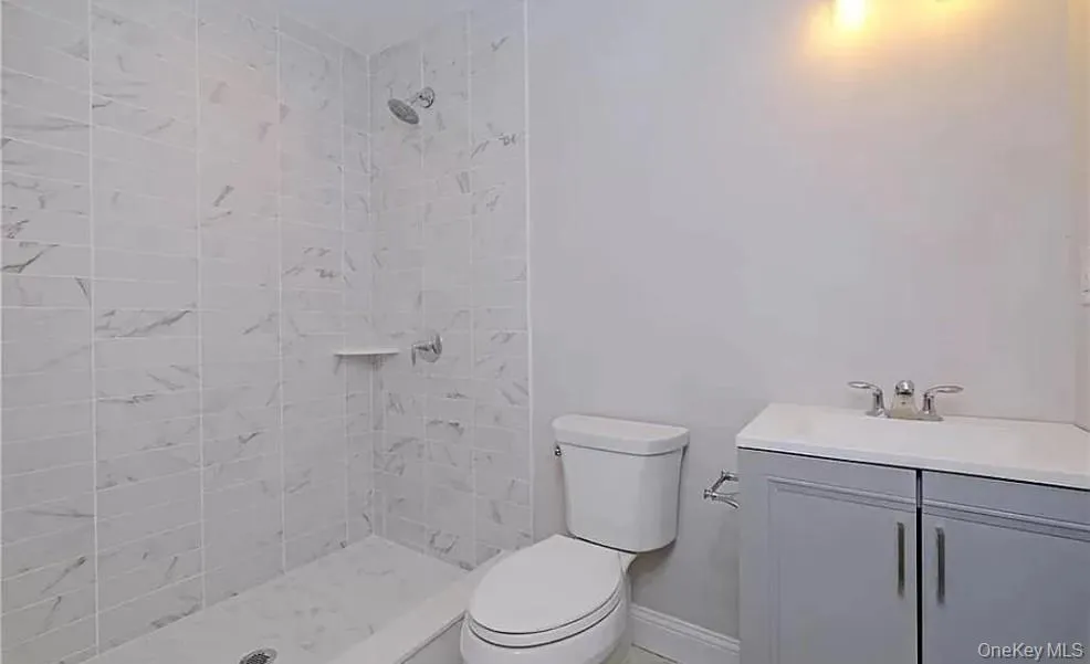 Bathroom with vanity and tiled shower Bathroom with vanity and tiled shower