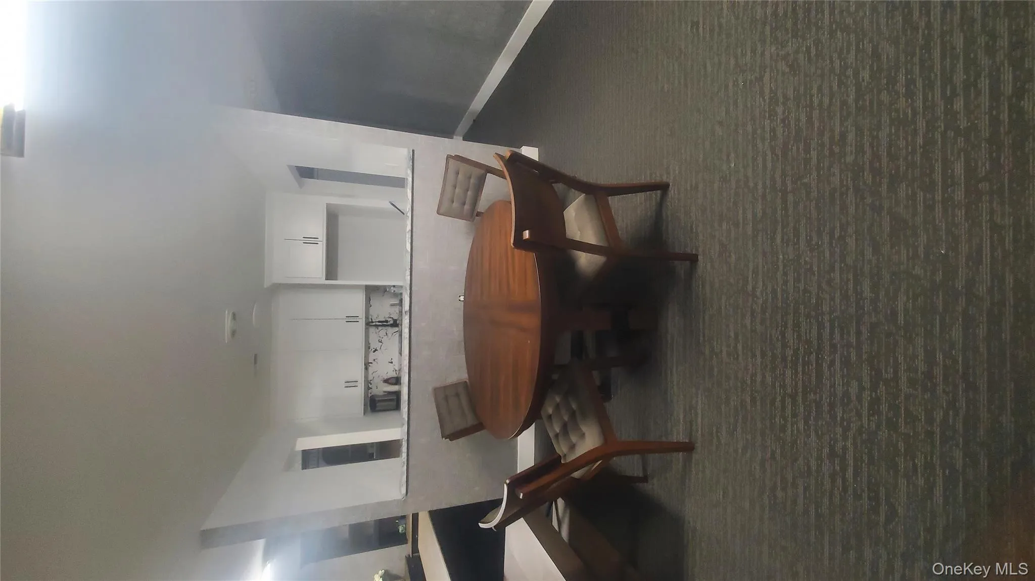 Dining space with dark carpet Dining space with dark carpet