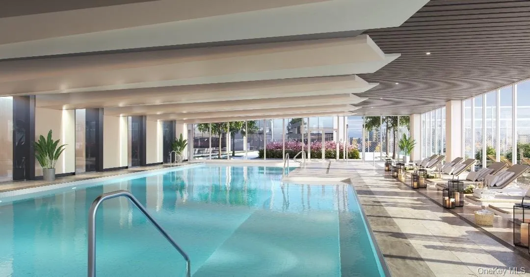 Indoor community pool with a patio Indoor community pool with a patio