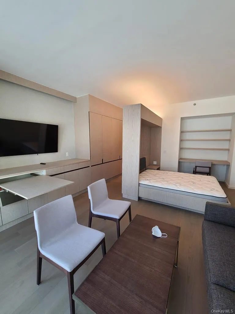 Bedroom with wood finished floors and a closet Bedroom with wood finished floors and a closet