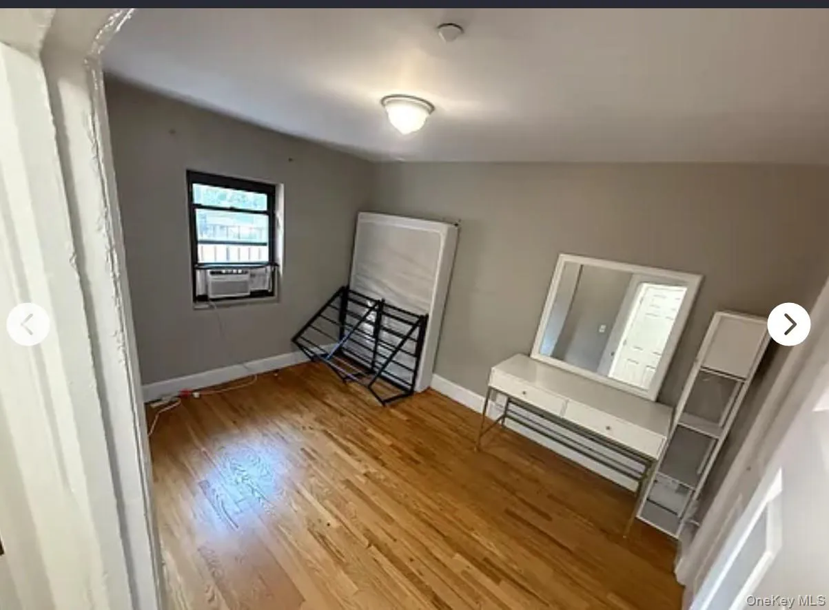 Unfurnished bedroom with light wood-style floors and baseboards Unfurnished bedroom with light wood-style floors and baseboards