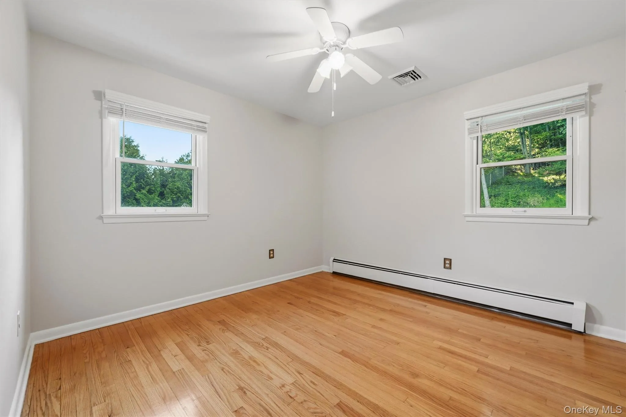 The second bedroom has a ceiling fan, two big windows and a closet, plus the same beautiful hardwood floors... adjacent is... The second bedroom has a ceiling fan, two big windows and a closet, plus the same beautiful hardwood floors... adjacent is...