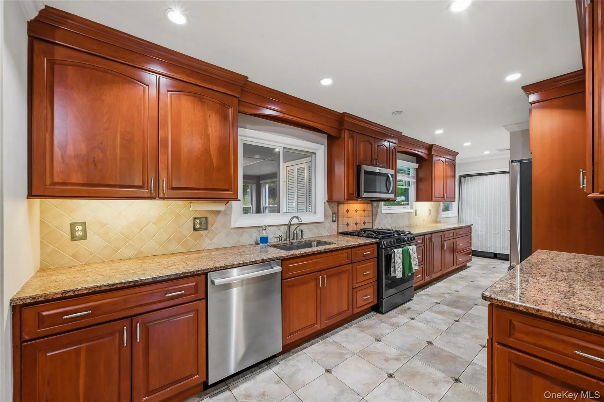 The WOW kitchen, "the heart of the home" features real tile flooring and granite countertops, in a galley style...with tons of storage in slow-close cherry cabinets... The WOW kitchen, "the heart of the home" features real tile flooring and granite countertops, in a galley style...with tons of storage in slow-close cherry cabinets...