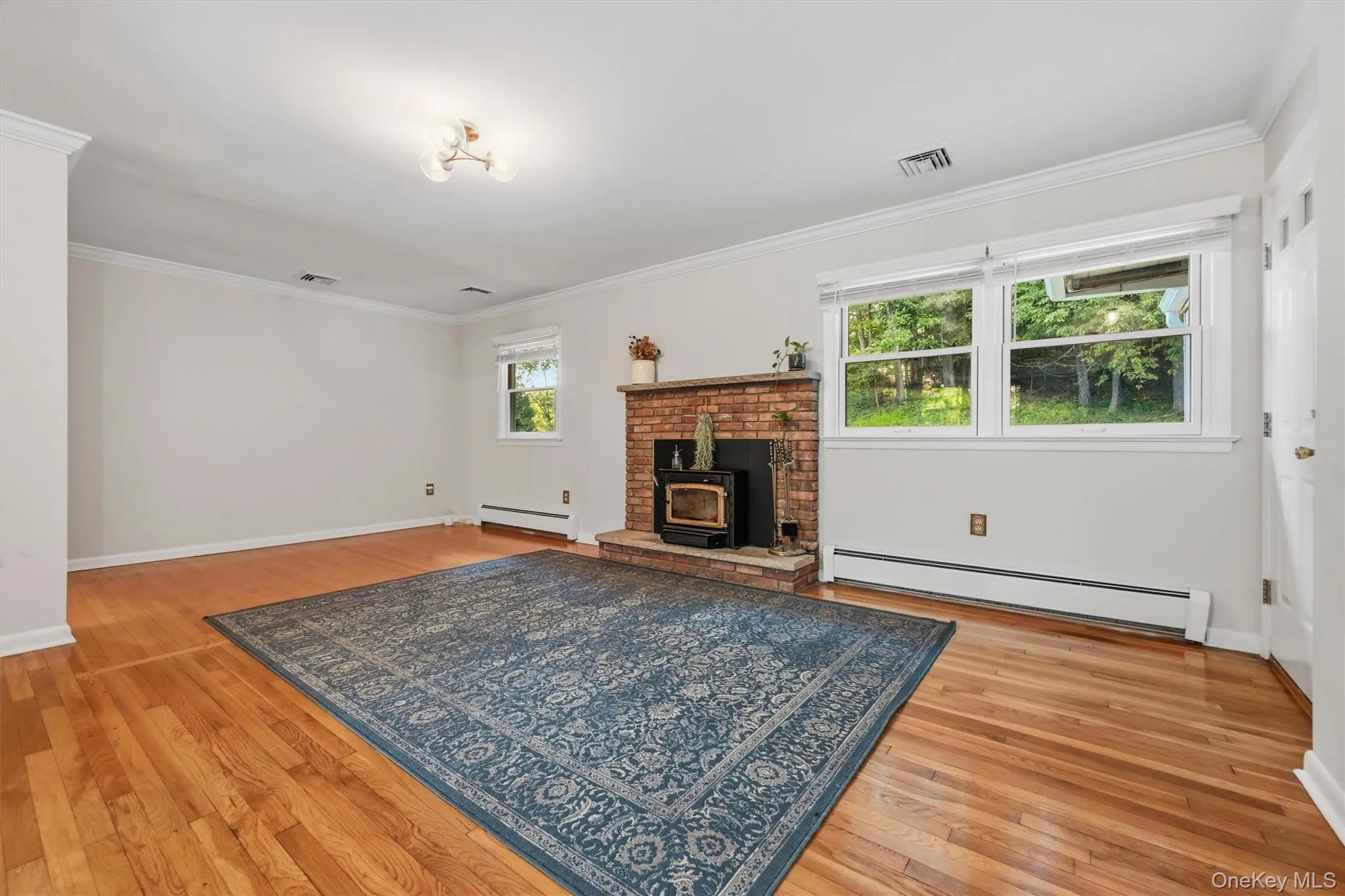 Design your own furniture layout in this spacious living room with gleaming hardwood floors... Design your own furniture layout in this spacious living room with gleaming hardwood floors...