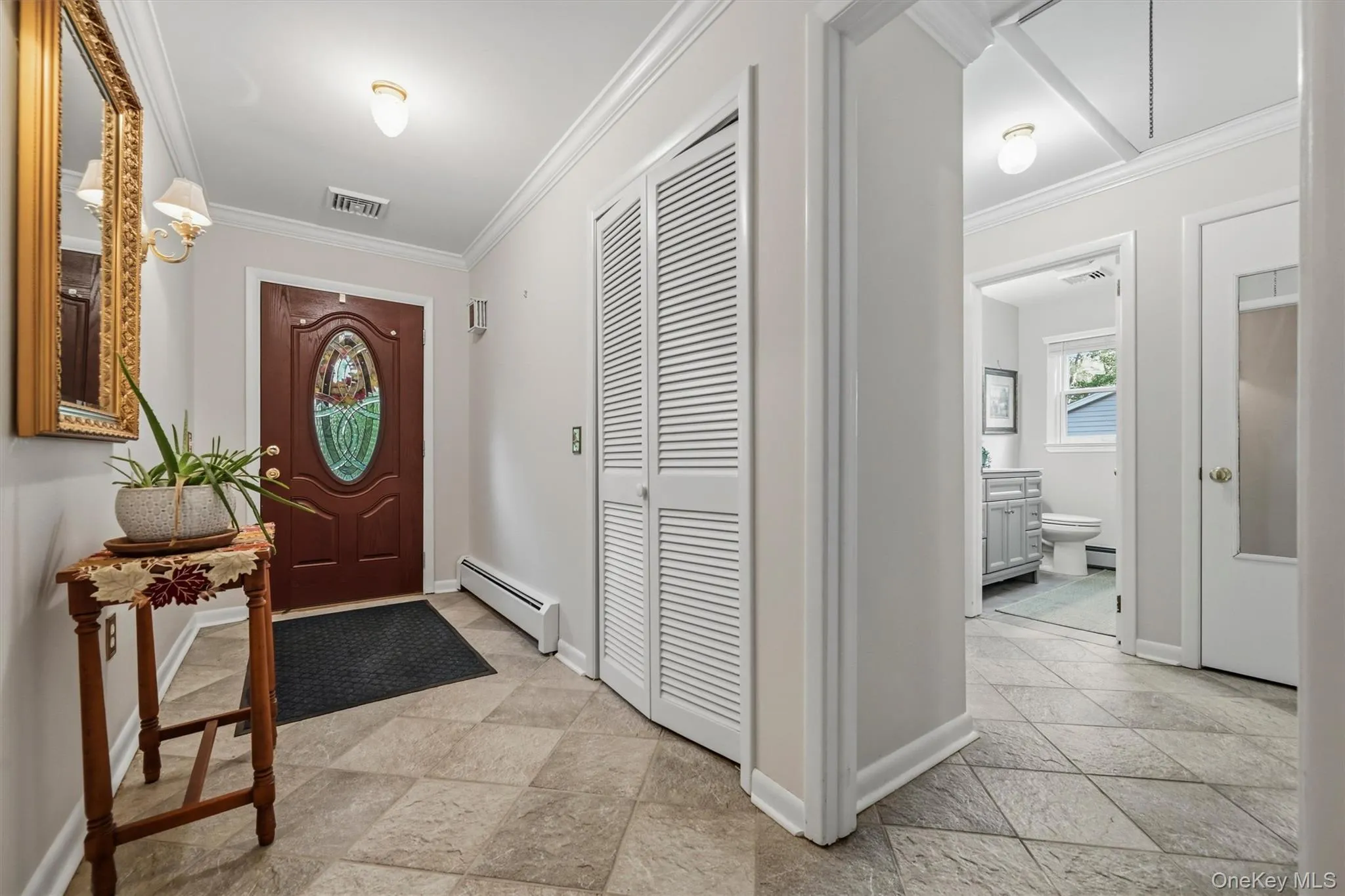 ...to a true foyer, with real tile flooring, and handy coat closet ... ...to a true foyer, with real tile flooring, and handy coat closet ...