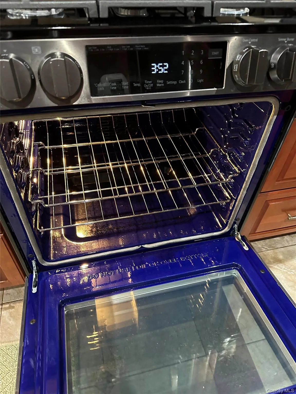 ...with stainless appliances -- all brand new in 2026 including this LG oven/range... with that striking blue color! Also a Bosch dishwasher and refrigerator, ('25)... ...with stainless appliances -- all brand new in 2026 including this LG oven/range... with that striking blue color! Also a Bosch dishwasher and refrigerator, ('25)...