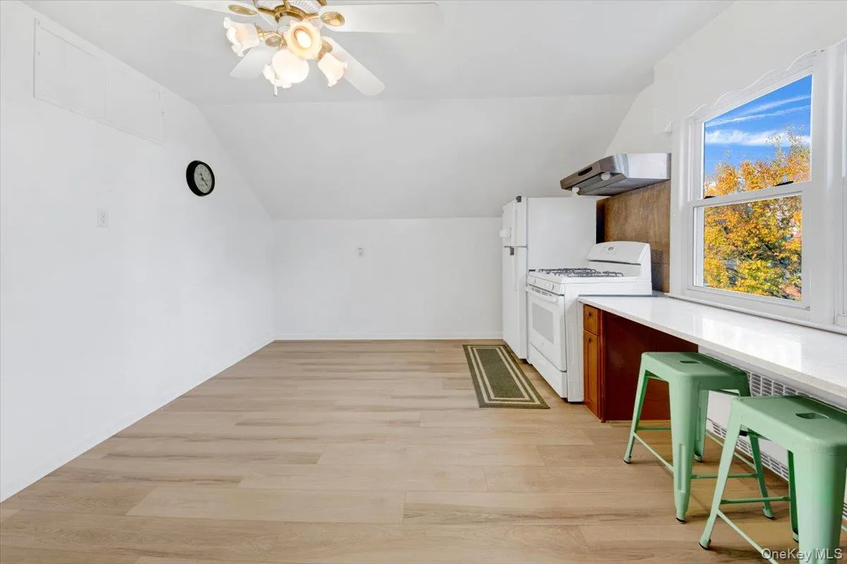 Eat-in Kitchen featuring counter w/ bar stools for extra seating Eat-in Kitchen featuring counter w/ bar stools for extra seating
