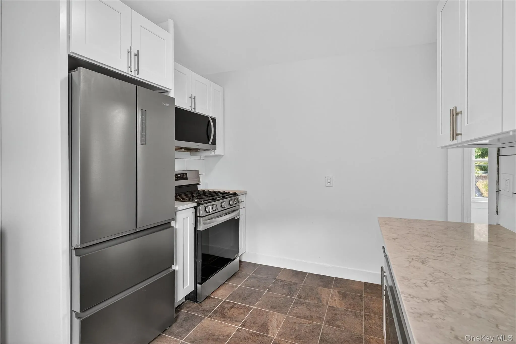 Kitchen with stainless steel appliances and white cabinets Kitchen with stainless steel appliances and white cabinets