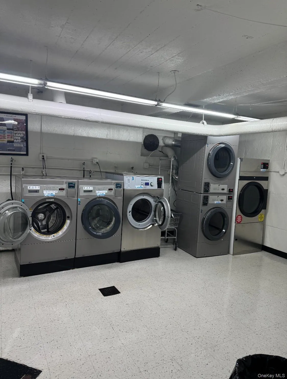 Community laundry featuring estacked washer and dryer and independent washer and dryer Community laundry featuring estacked washer and dryer and independent washer and dryer