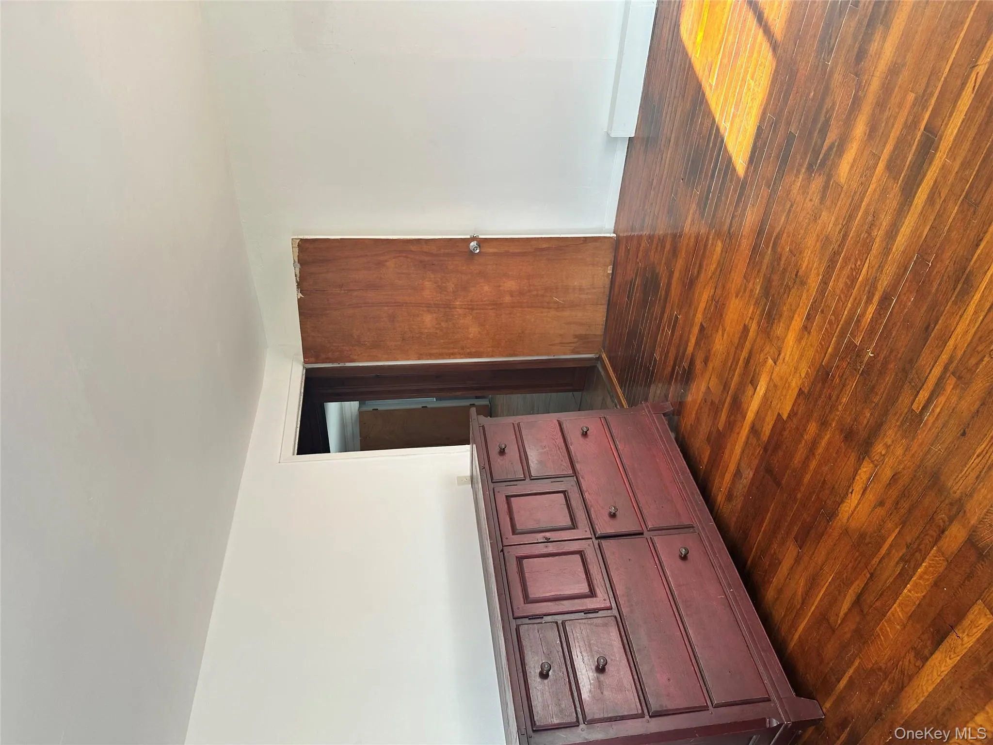 Unfurnished bedroom featuring dark wood-style floors Unfurnished bedroom featuring dark wood-style floors