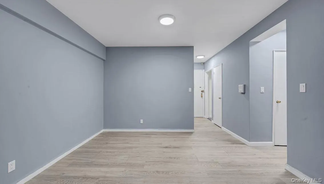 view of dining area, front door, entryway closet, hallway to additional closet, bathroom , and bedroom. view of dining area, front door, entryway closet, hallway to additional closet, bathroom , and bedroom.