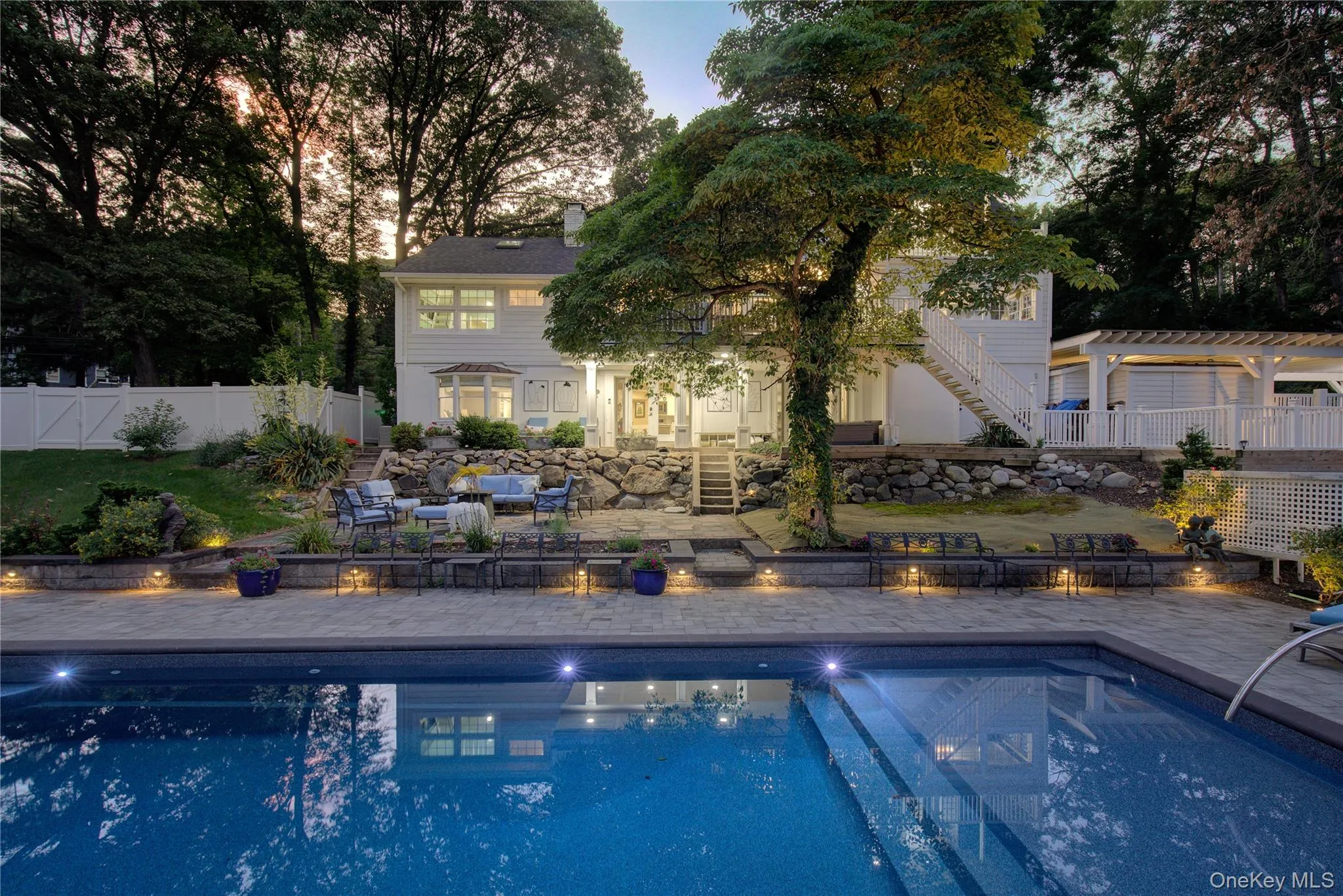 View of pool featuring a patio and stairs View of pool featuring a patio and stairs