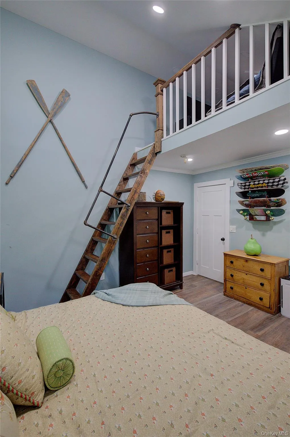 Bedroom featuring recessed lighting and wood finished floors Bedroom featuring recessed lighting and wood finished floors