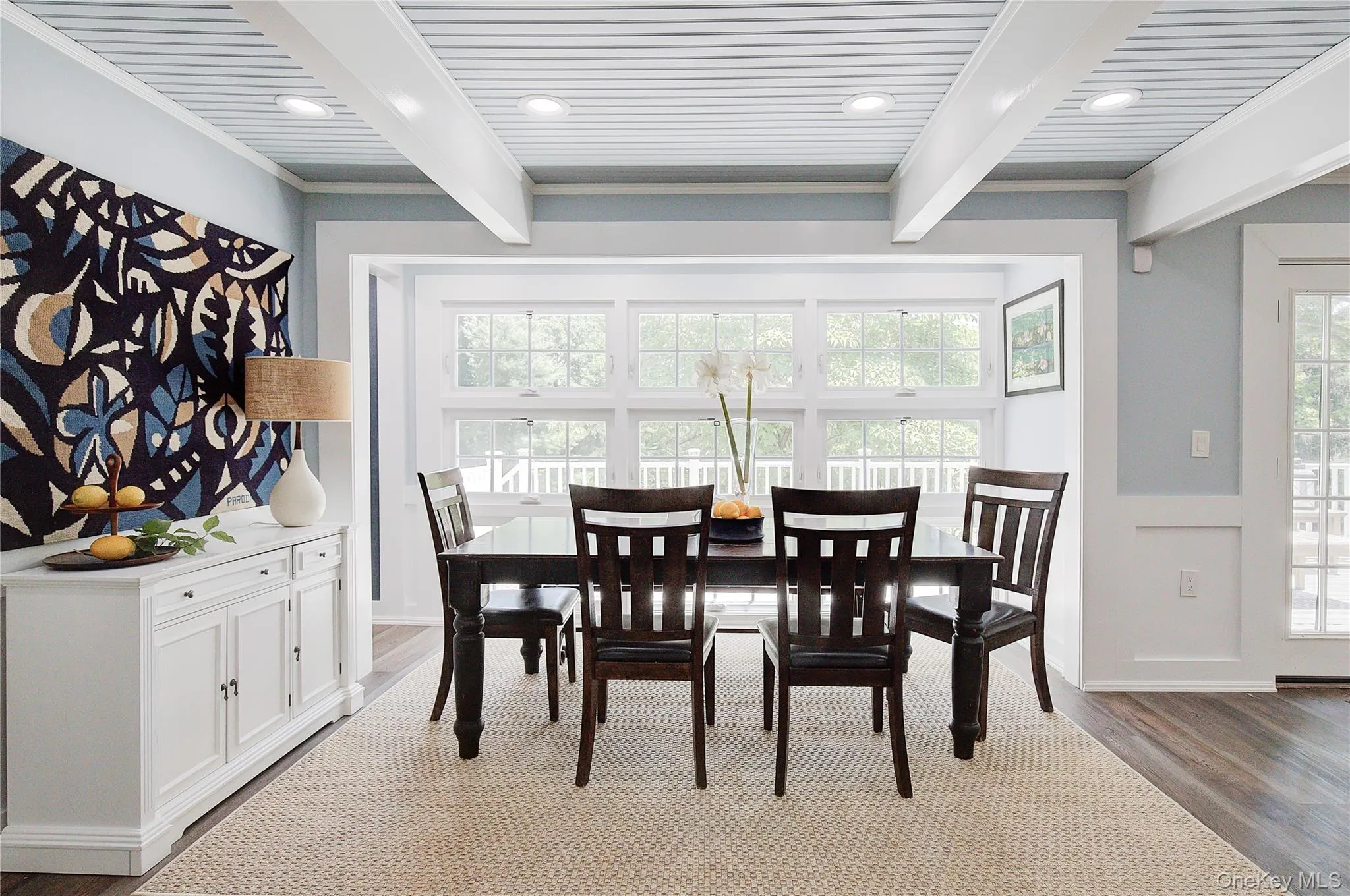 Dining room featuring beamed ceiling, wood finished floors, and recessed lighting Dining room featuring beamed ceiling, wood finished floors, and recessed lighting