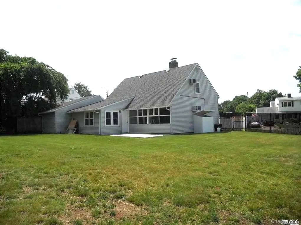 Back of property with a patio area and a chimney Back of property with a patio area and a chimney