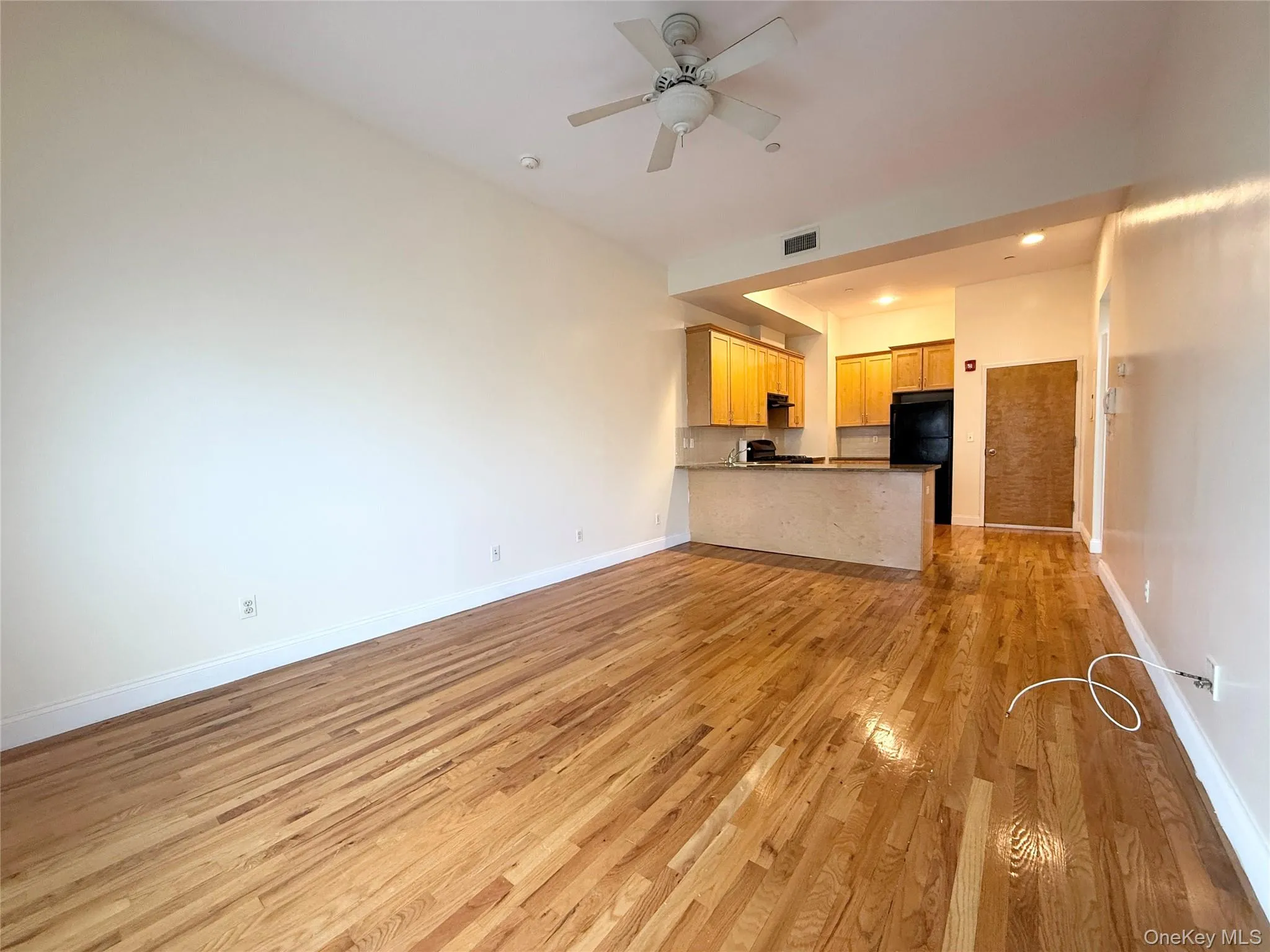 Unfurnished living room featuring light wood finished floors, recessed lighting, and ceiling fan Unfurnished living room featuring light wood finished floors, recessed lighting, and ceiling fan