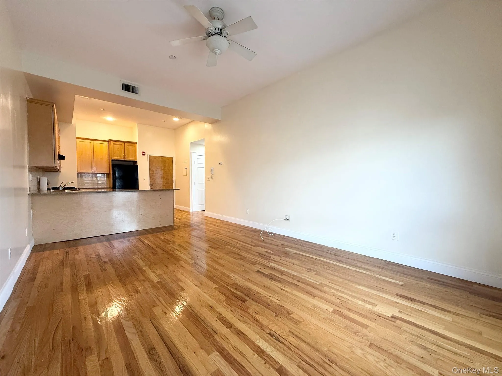 Unfurnished living room featuring light wood-type flooring, recessed lighting, and ceiling fan Unfurnished living room featuring light wood-type flooring, recessed lighting, and ceiling fan