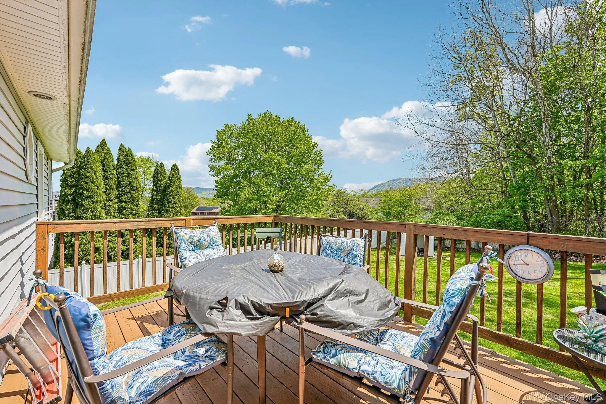 Wood deck with wooden railings and a light-colored siding exterior. some photos may include virtually staged or digitally modified Wood deck with wooden railings and a light-colored siding exterior. some photos may include virtually staged or digitally modified