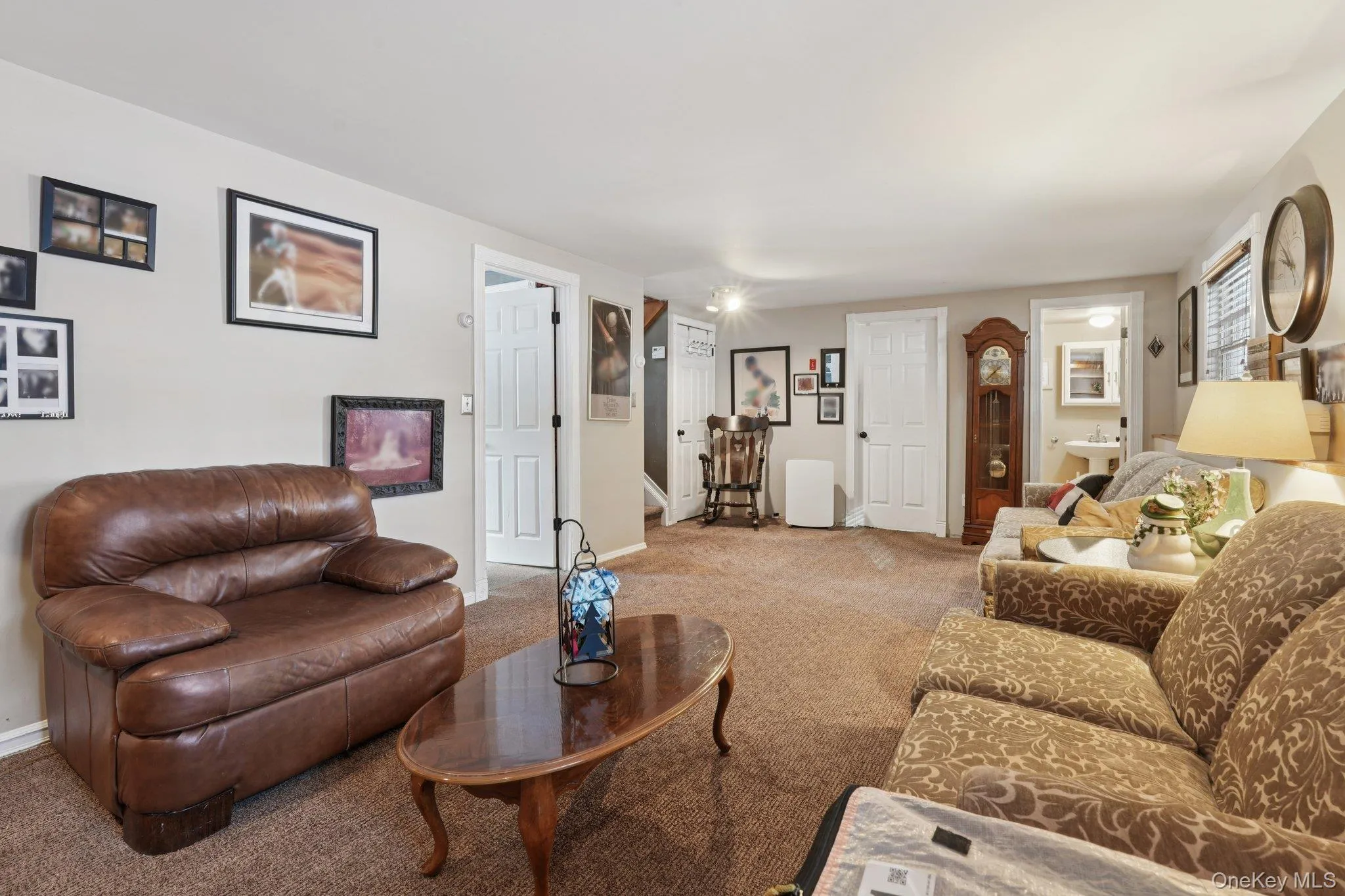 Lower level Living area featuring carpet flooring. some photos may include virtually staged or digitally modified Lower level Living area featuring carpet flooring. some photos may include virtually staged or digitally modified