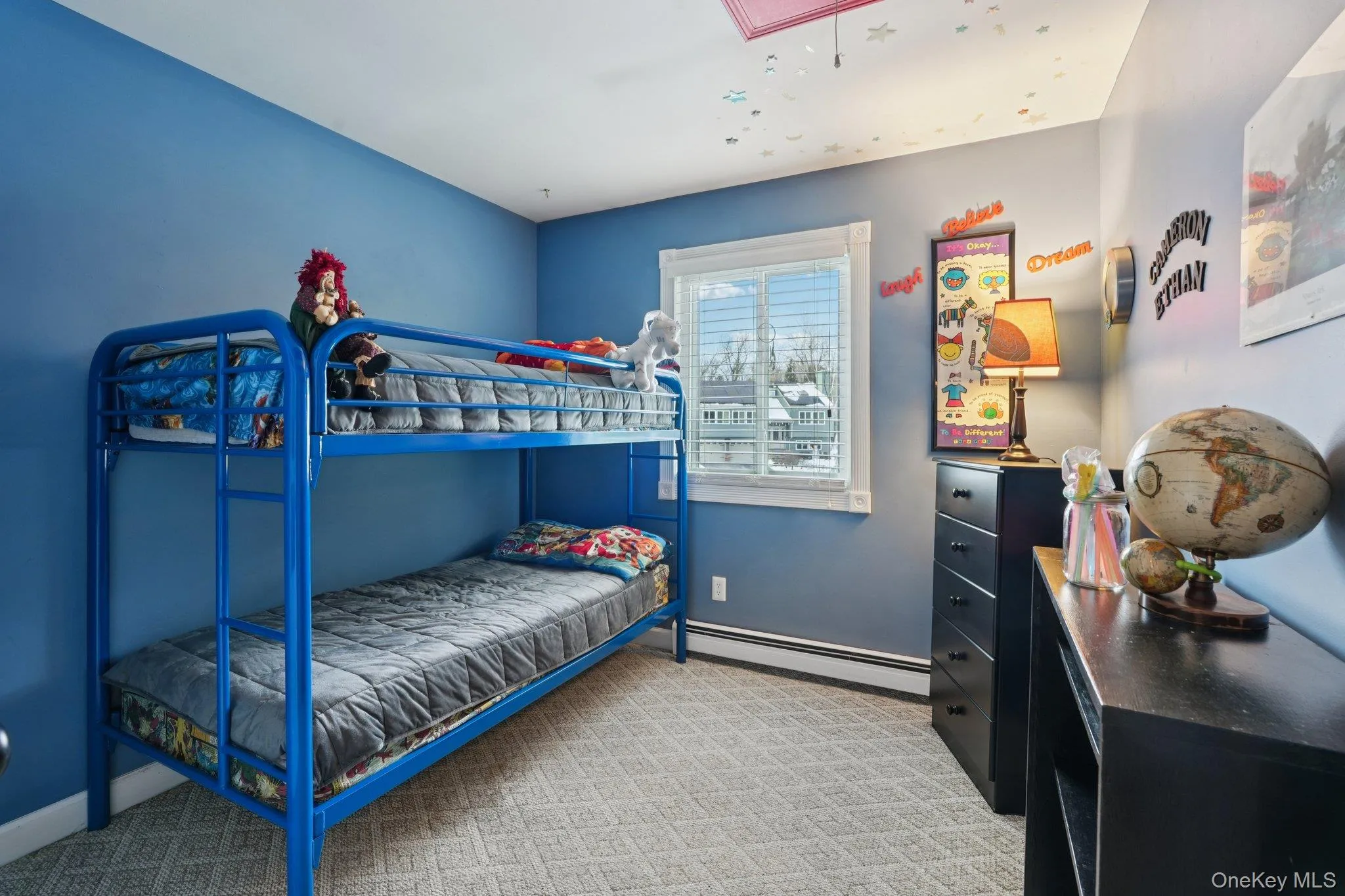 3rd Bedroom with a baseboard heating unit, attic access, and light carpet.some photos may include virtually staged or digitally modified 3rd Bedroom with a baseboard heating unit, attic access, and light carpet.some photos may include virtually staged or digitally modified