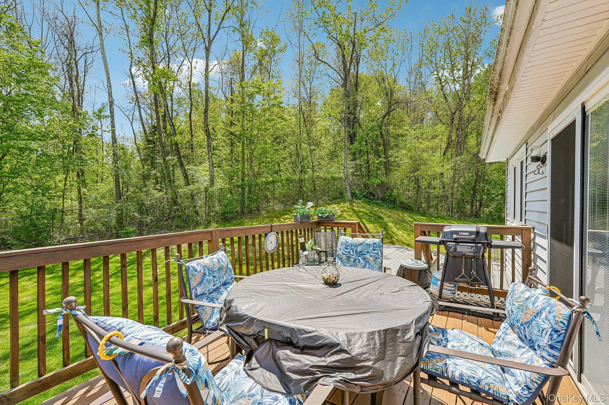 Wood-finish deck with a perimeter railing. some photos may include virtually staged or digitally modified Wood-finish deck with a perimeter railing. some photos may include virtually staged or digitally modified