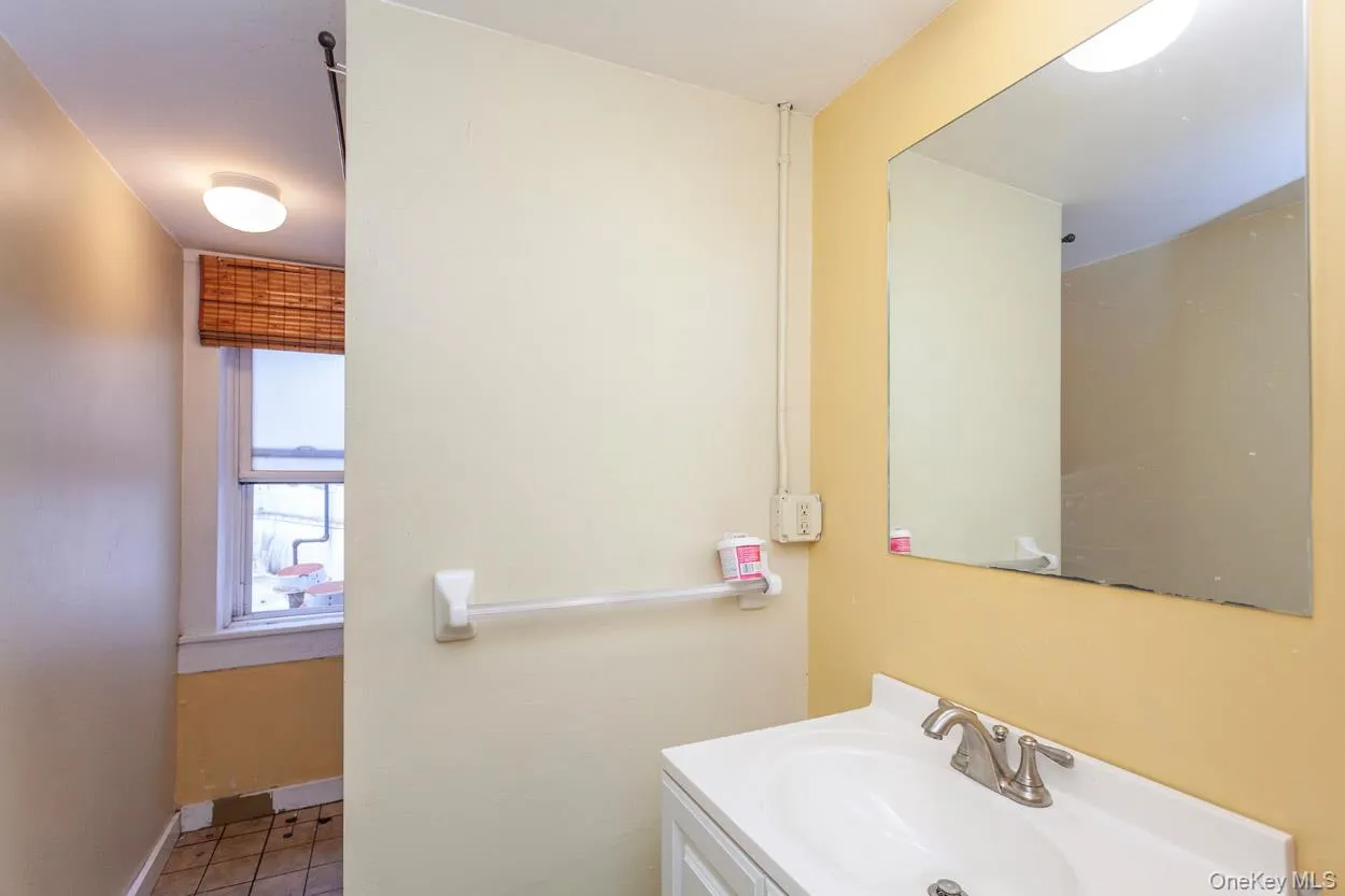 Bathroom featuring vanity and tile patterned flooring Bathroom featuring vanity and tile patterned flooring