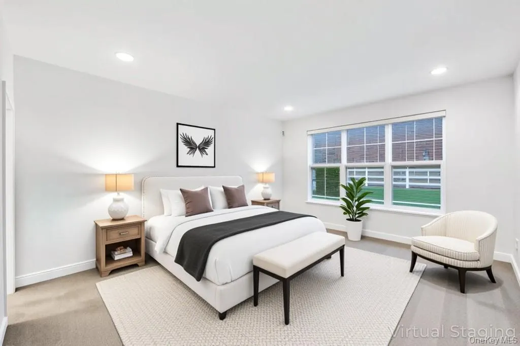 Bedroom with light colored carpet and recessed lighting Bedroom with light colored carpet and recessed lighting