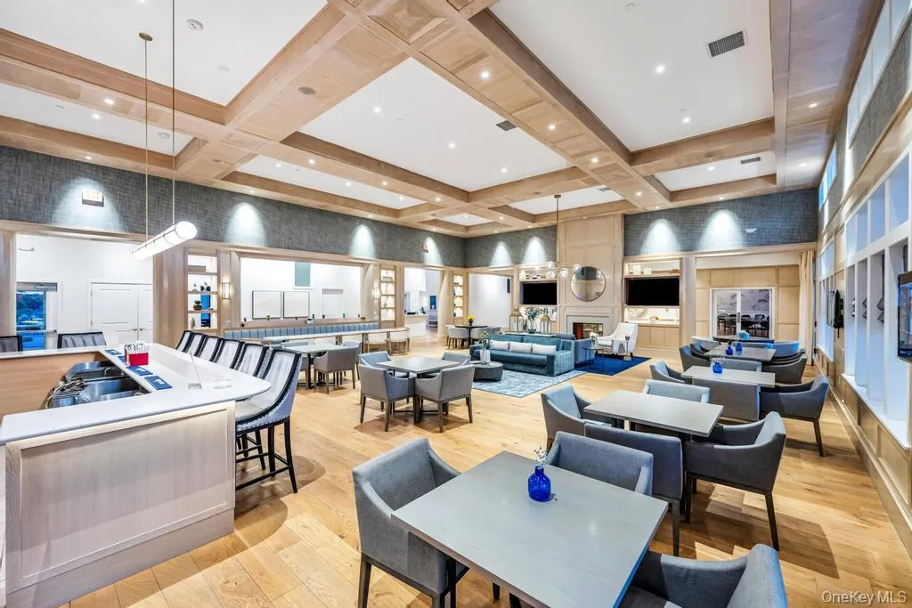 Common area with coffered ceiling, a high ceiling, and beamed ceiling Common area with coffered ceiling, a high ceiling, and beamed ceiling
