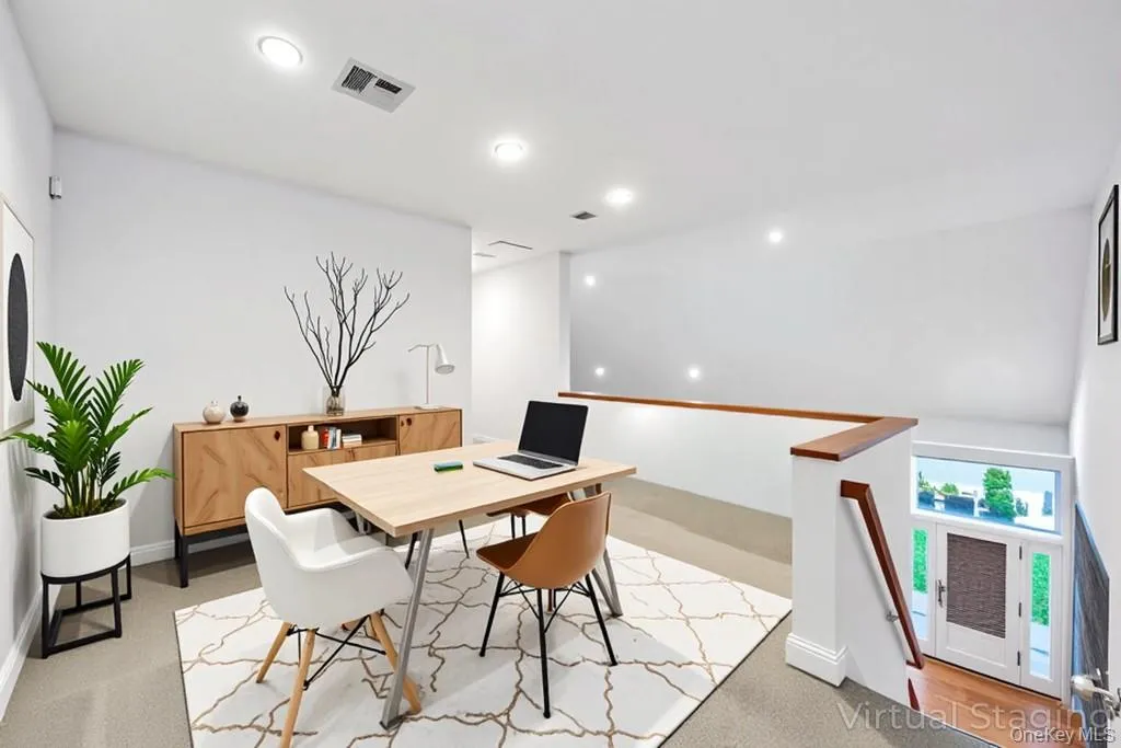 Dining area featuring an office area, recessed lighting, and light colored carpet Dining area featuring an office area, recessed lighting, and light colored carpet