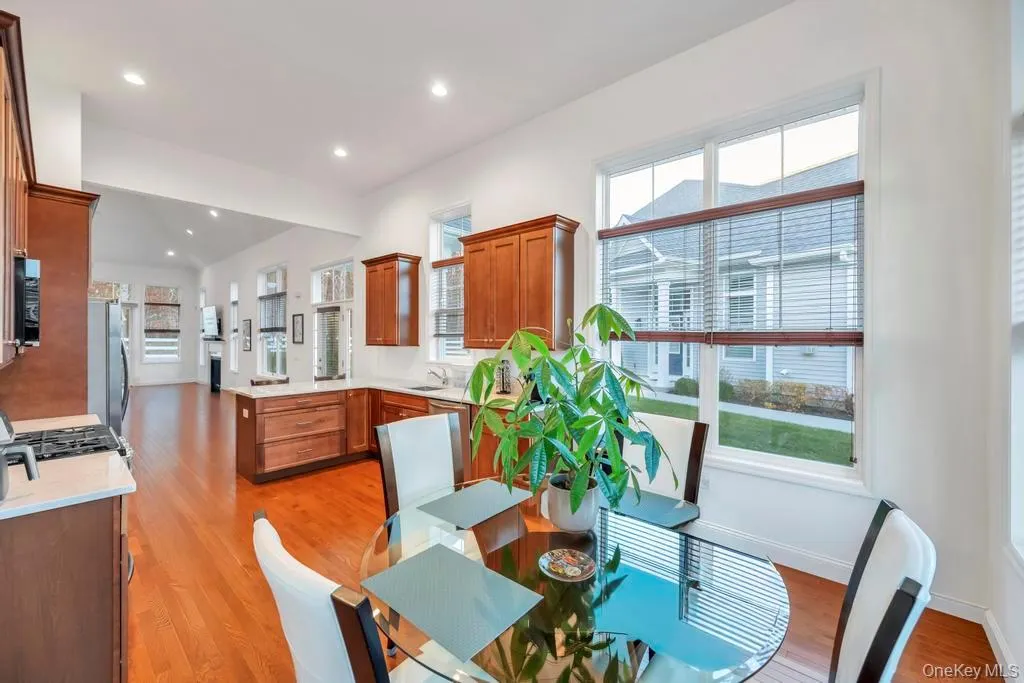 Dining area featuring light wood finished floors and recessed lighting Dining area featuring light wood finished floors and recessed lighting