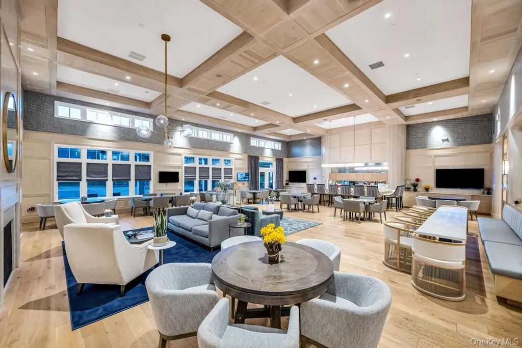 Community lobby with a towering ceiling, coffered ceiling, and beam ceiling Community lobby with a towering ceiling, coffered ceiling, and beam ceiling