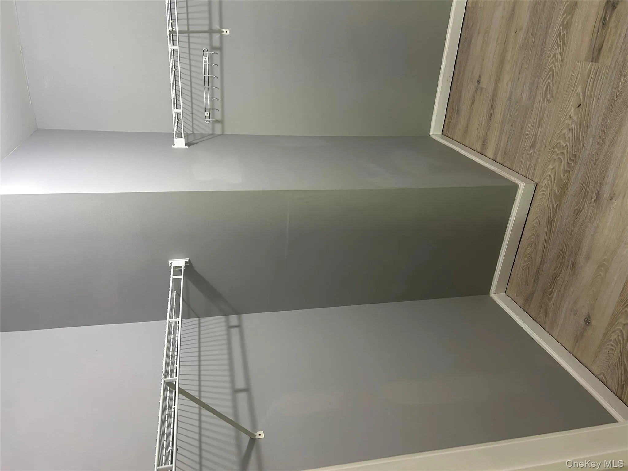 Spacious closet featuring wood finished floors Spacious closet featuring wood finished floors