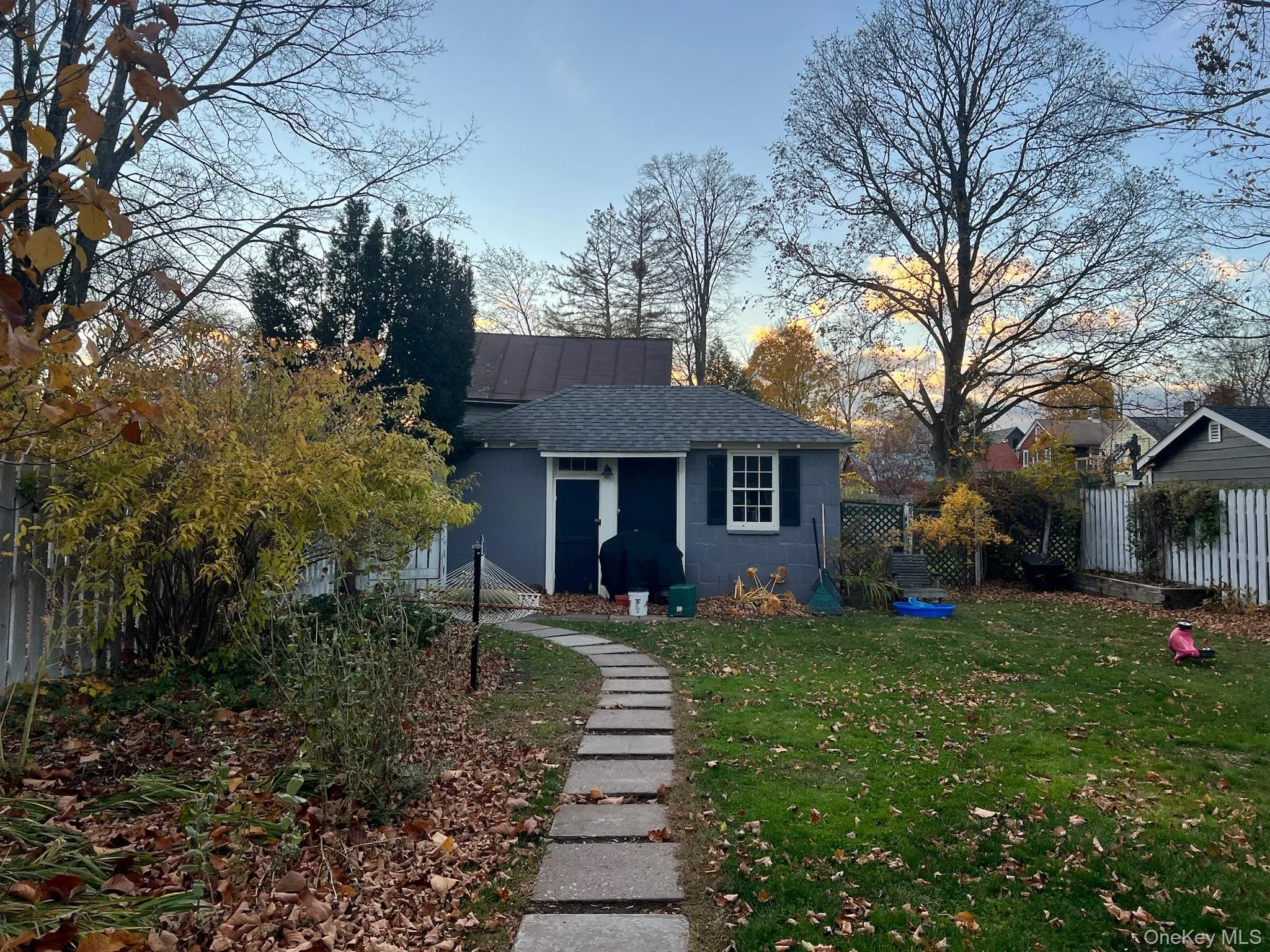 View of front of property featuring roof with shingles and concrete block siding View of front of property featuring roof with shingles and concrete block siding