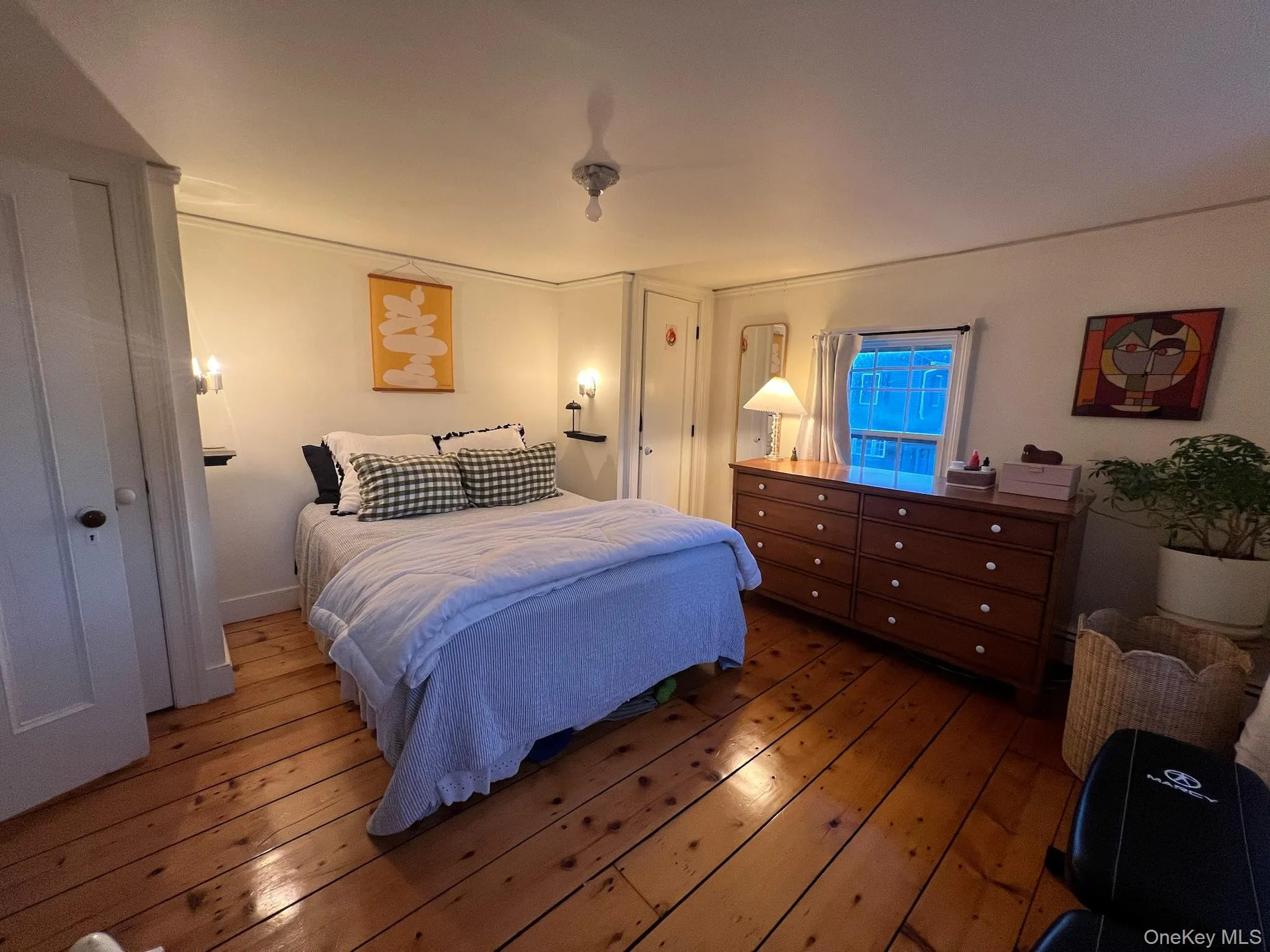 Bedroom featuring hardwood / wood-style floors Bedroom featuring hardwood / wood-style floors