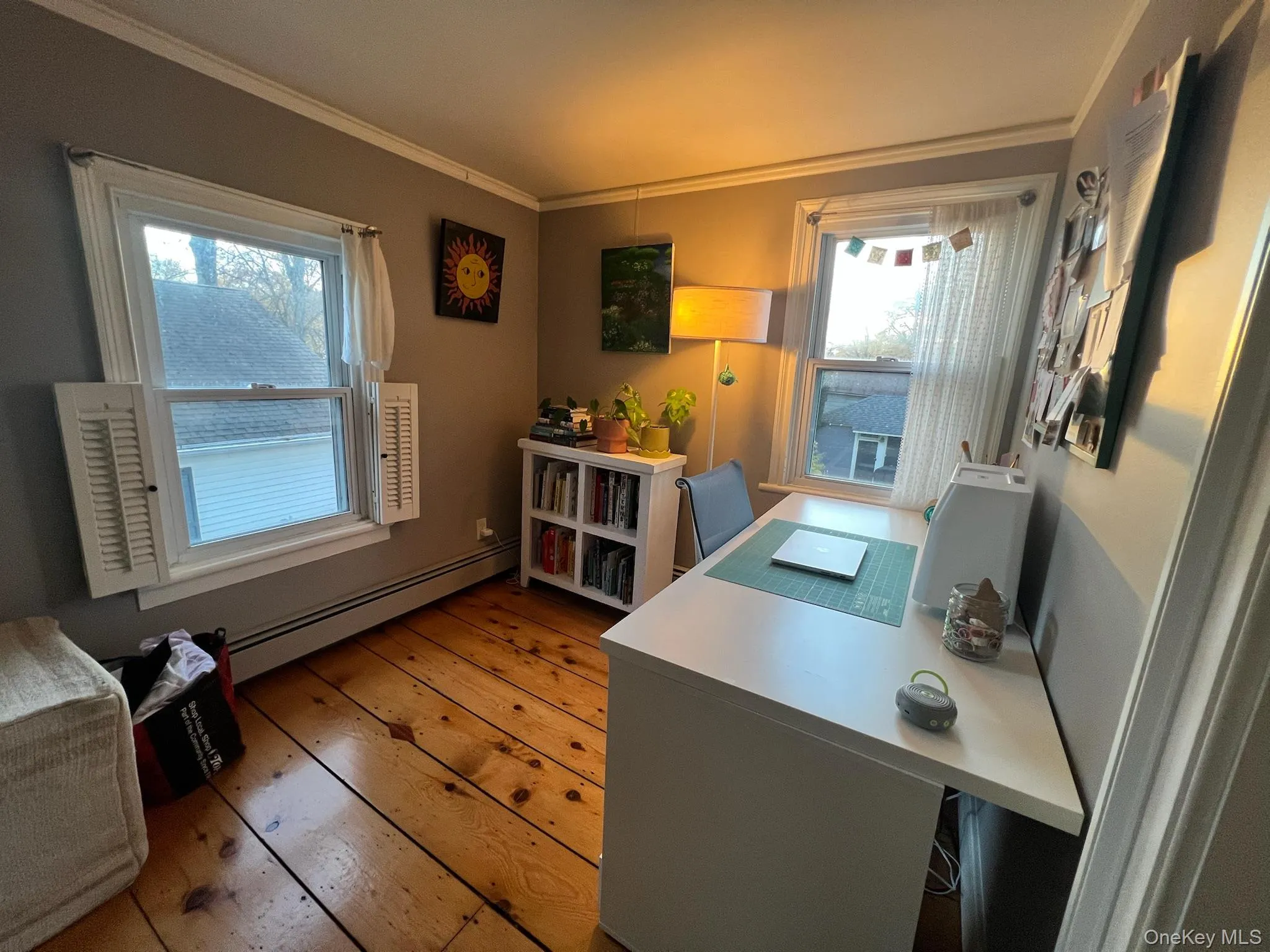 second floor Office featuring a baseboard heating unit, light wood-type flooring, and ornamental molding second floor Office featuring a baseboard heating unit, light wood-type flooring, and ornamental molding