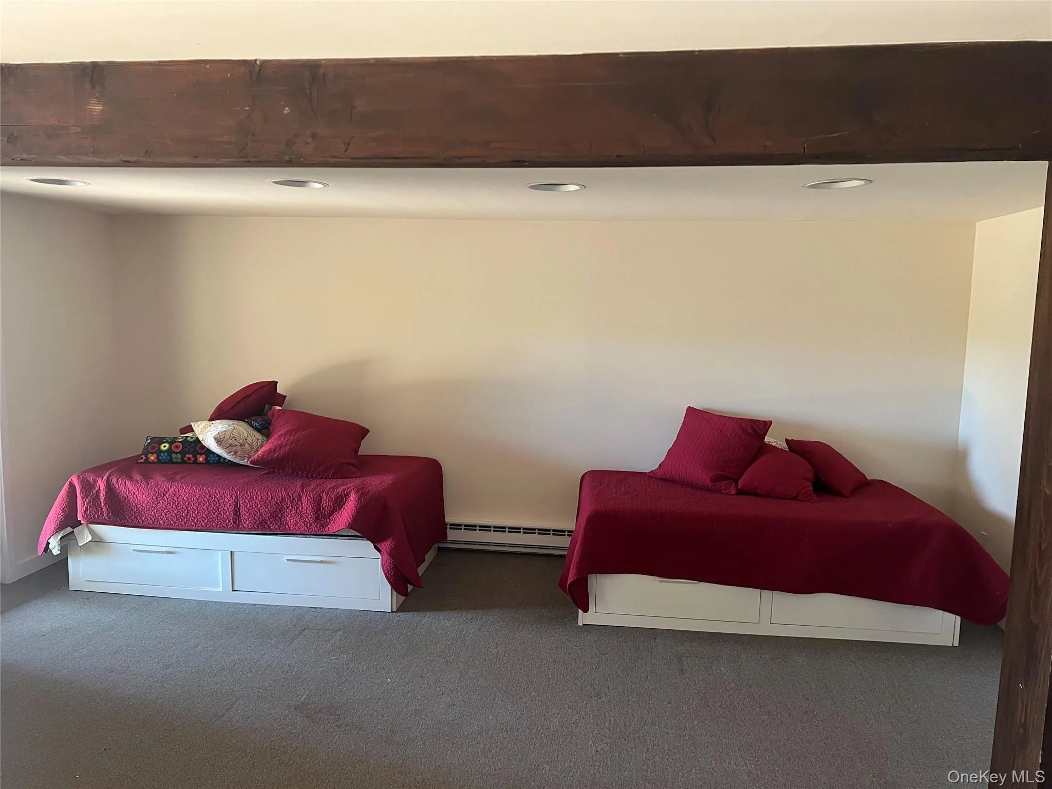 Bonus Bedroom featuring carpet floors, baseboard heating, and recessed lighting Bonus Bedroom featuring carpet floors, baseboard heating, and recessed lighting