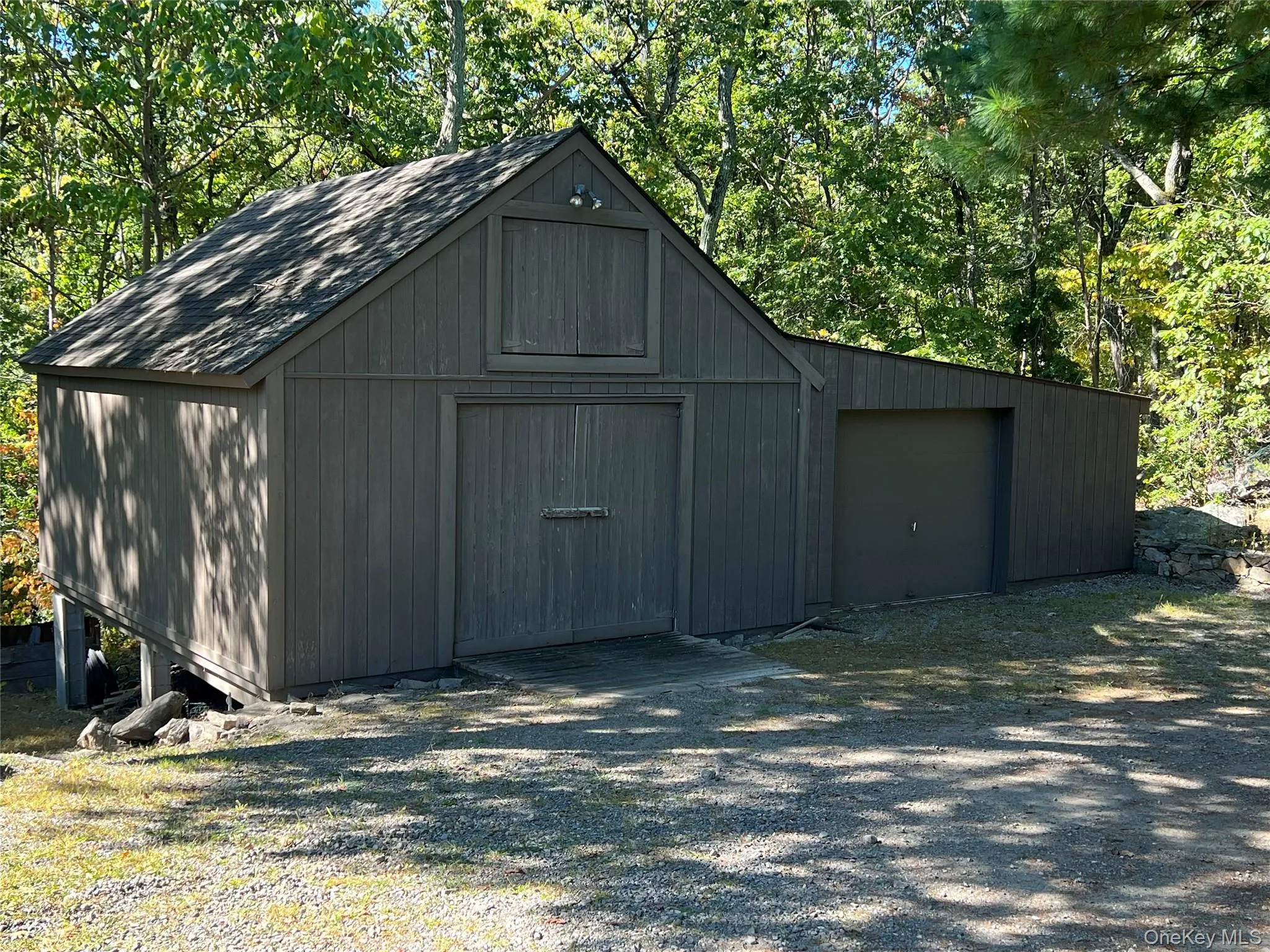 View of outbuilding with view of wooded area View of outbuilding with view of wooded area