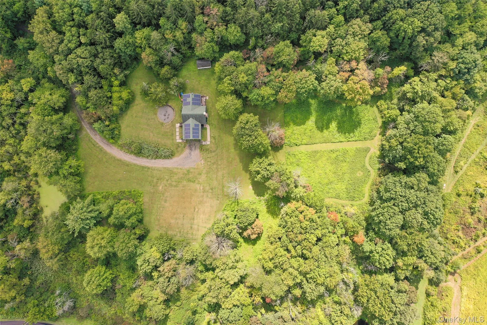 View of property location with a heavily wooded area View of property location with a heavily wooded area