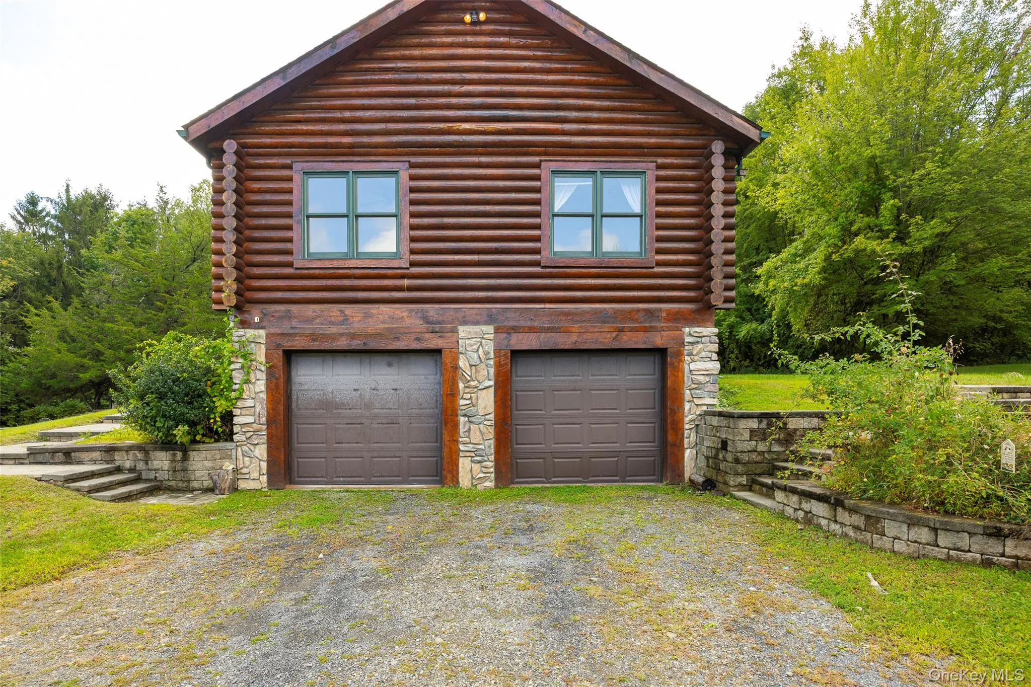 Garage featuring driveway Garage featuring driveway