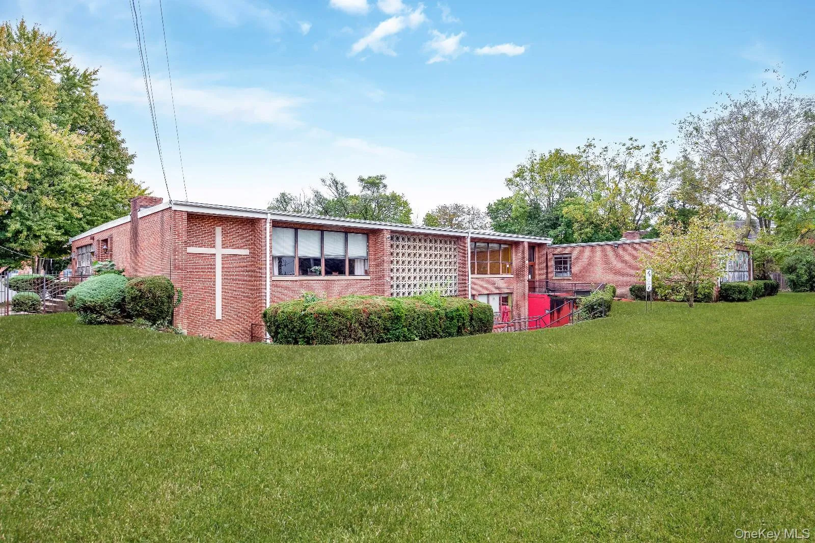 View of front of house with a front lawn and brick siding View of front of house with a front lawn and brick siding
