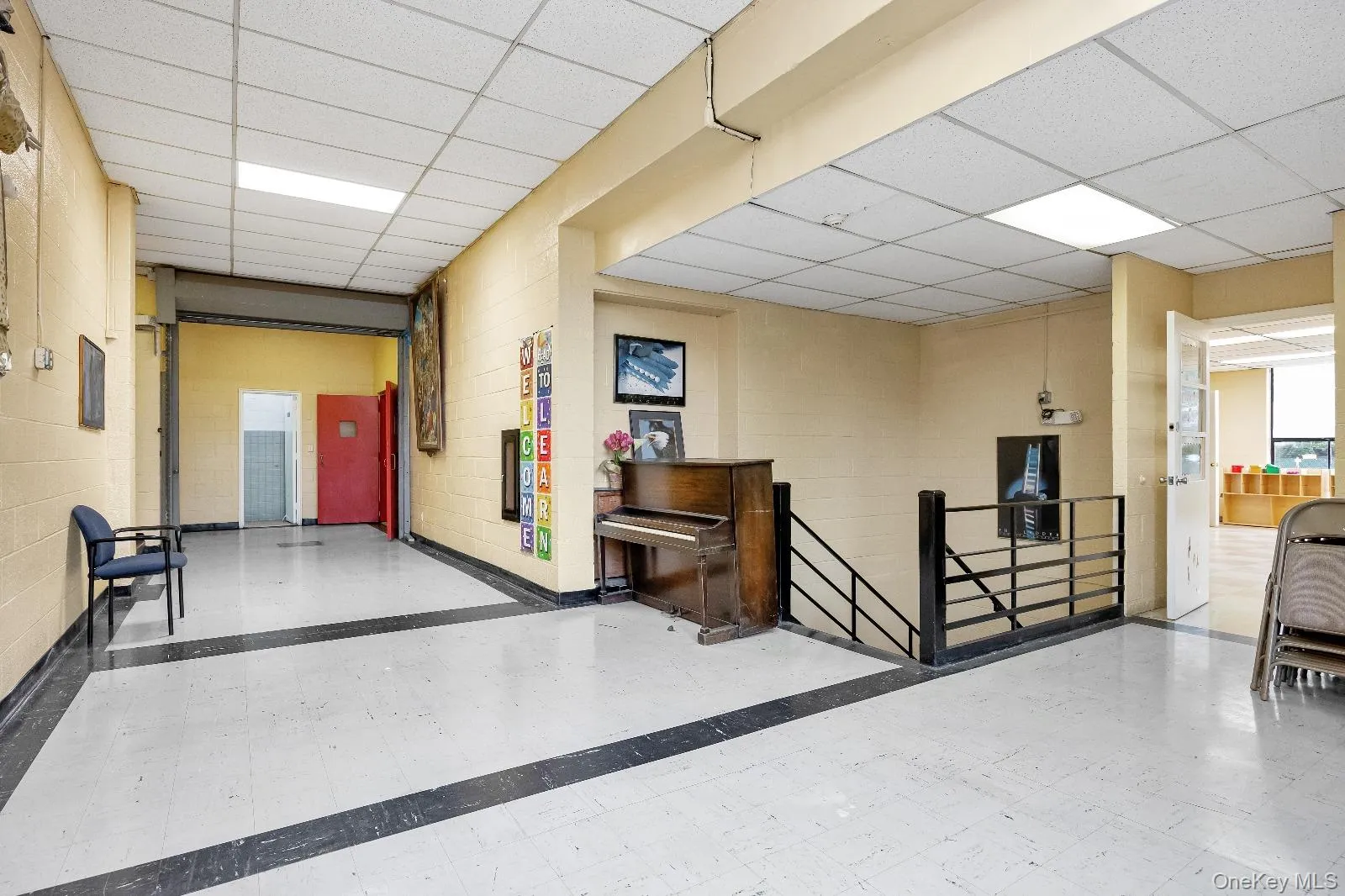 Community lobby featuring a drop ceiling Community lobby featuring a drop ceiling