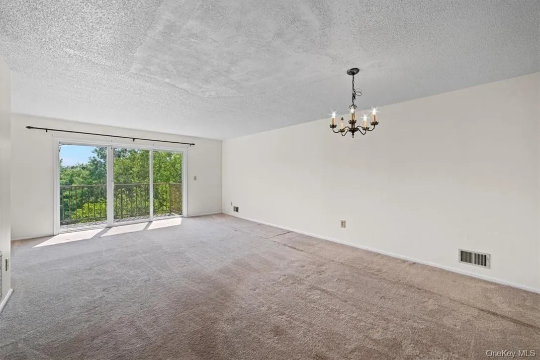 Living Room w/ SGD to Deck / Dining Area Living Room w/ SGD to Deck / Dining Area